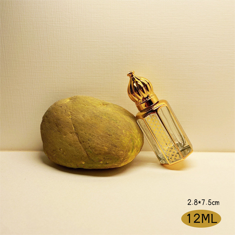 Dubai Perfume Aceite Esencial sub-botella artificial cristal artesanía metal transparente botella de perfume de vidrio dorado al por mayor
