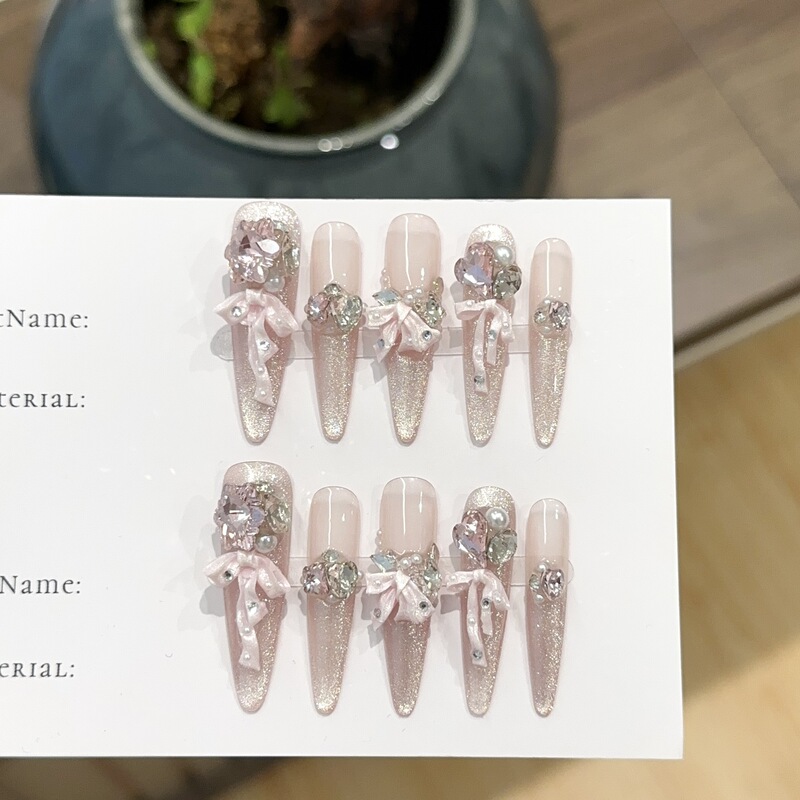 Purely Handmade Pink Cat-Eye Long Nail Tips with European and American Style Rhinestones and Dazzling Bowknot Fake Nail Stickers Purely Handmade Pink Cat-Eye Long Nail Tips with European and American Style Rhinestones and Dazzling Bowknot Fake Nail Stickers