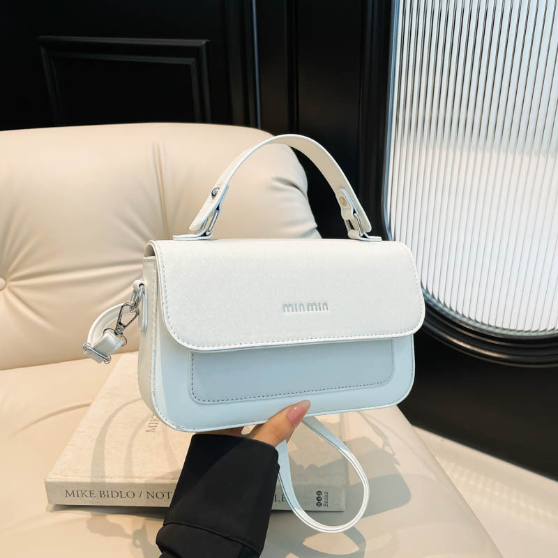 Textura al por mayor de lujo ligero bolso de mano bolso de mujer otoño 2025 nuevo estilo extranjero empalme bolso de hombro bolso de viaje