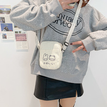 可爱卡通帆布手机包2025年新款印花潮手提甜美单肩斜挎包零花钱