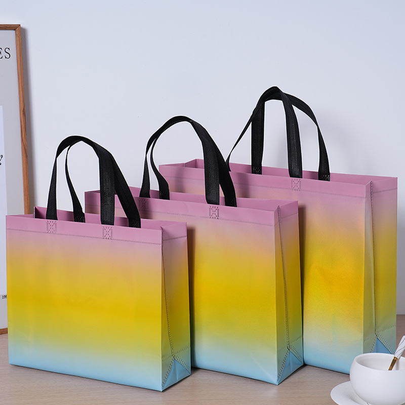 Bolsas de tela no tejida con película láser de tres colores de alta calidad, bolsas para hombres y mujeres de alto valor, grosor personalizado LOGO