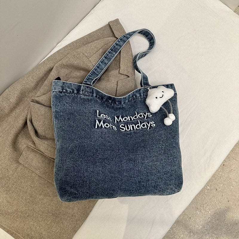 Bolsa de denim casual de gran capacidad para mujeres 2024 nueva bolsa de hombro de viaje, bolsa universitaria ligera y versátil
