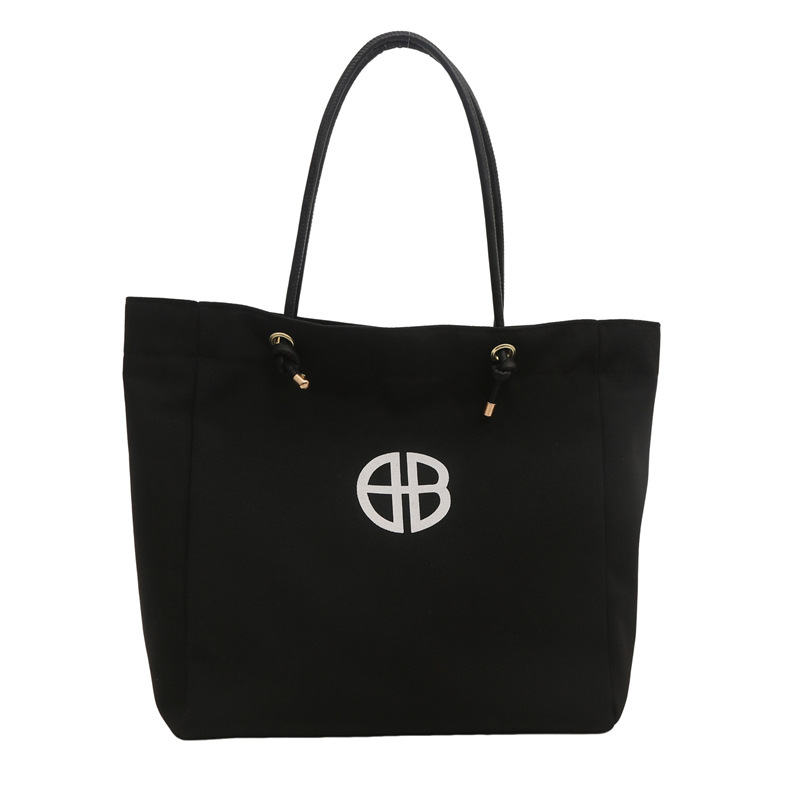 Bolsa de lienzo de gran capacidad de letras para mujeres este año nueva bolsa de hombro de moda universal bolsa de viaje bolsa de mano bolsa de mamá