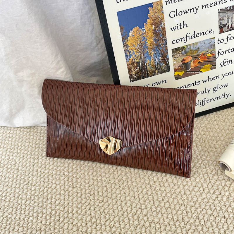 Casual simple estilo exterior de moda sobre de mano bolsas de mujer verano 2026 nuevo nicho coreano diseño textura de viaje