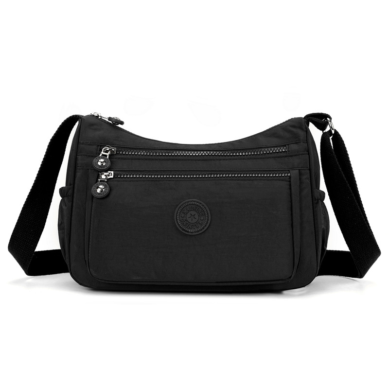 Bolsos bolsos para madres de mediana edad y ancianas 2024 nuevo bolso de mensajero de un solo hombro de tela de nailon bolso de bola de masa casual de viaje bolso de mujer