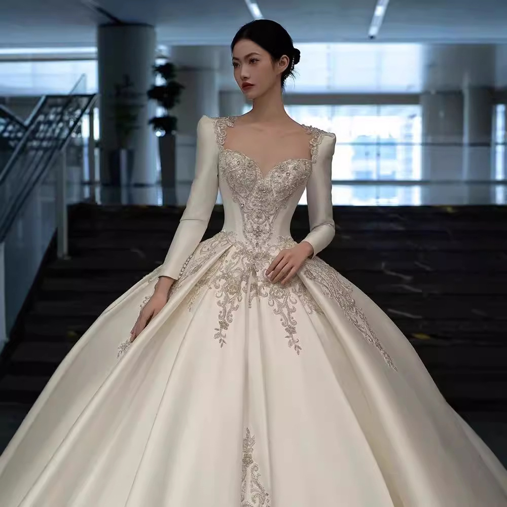 Vestido de novia de satén texturizado de alta gama, estilo invierno 2026, de manga larga, estilo princesa, con cola, de lujo, estilo francés.