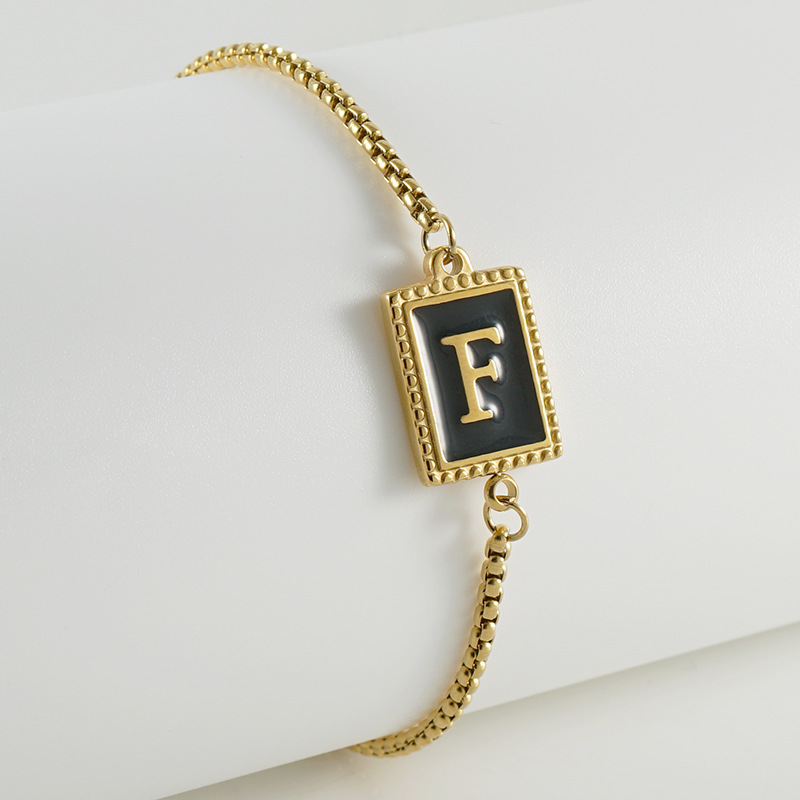 La moda europea y americana transfronteriza del acero inoxidable 26 pulsera inglesa de la letra en relieve pulsera Titanium de la cremallera del acero 18K de la frontera para las mujeres