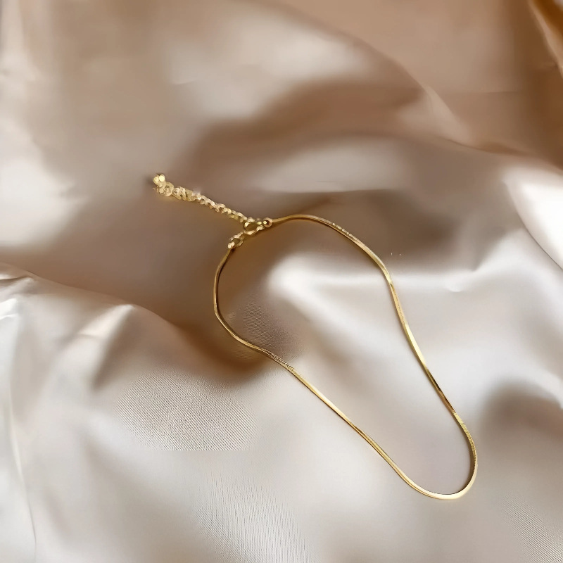 S925 plata esterlina chapado en oro de 14k extremadamente fino hueso de serpiente brazalete de nicho femenino diseño simple en línea inins pie de viento