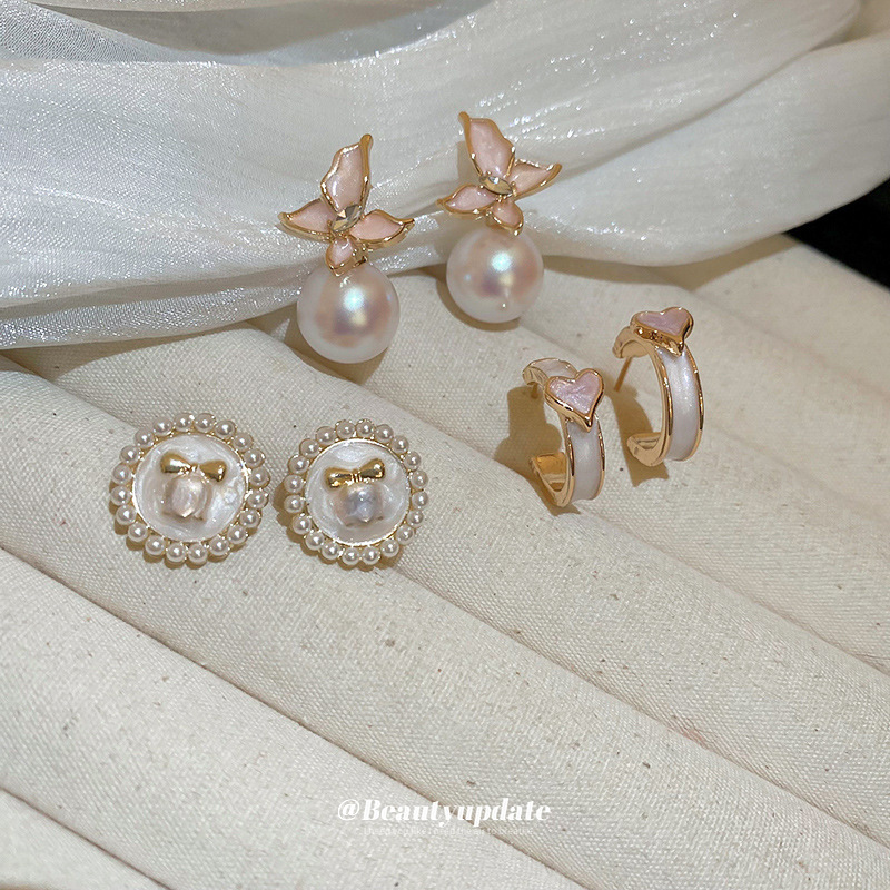 Aguja de plata Pendientes de perlas de flores de aceite que gotea rosa Pendientes de moda retro francesa súper hada Pendientes de lujo ligero de alta gama Mujeres