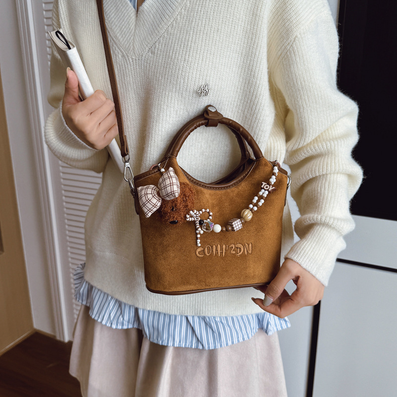 Otoño 2025 nuevo perro cuentas bolso de cubo bolso de viaje femenino estilo coreano retro mochila de hombro esmerilado