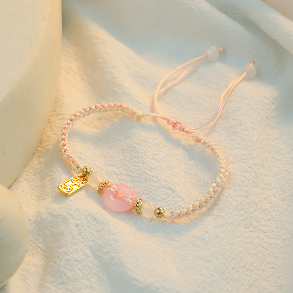 2025 nuevo amigas joyería de mano de melocotón de seguridad pulsera de pareja mujer ligera de lujo nicho tejido de mano