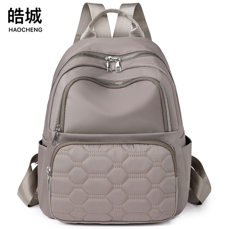 Fábrica al por mayor 2023 nueva mochila de nailon casual para mujer, línea de bordado de moda, mochila de viaje de gran capacidad, mochila escolar