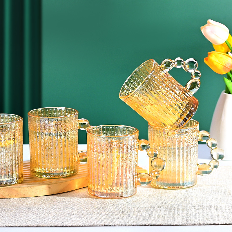 Taza de vidrio de perlas para engrosar taza de café doméstica de alto valor facial taza de leche de jugo fábrica de taza de agua al por mayor