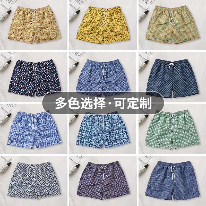 Pantalones de cuatro puntos florales de piel de melocotón para hombre, bañador casual de playa de tamaño europeo, forro de secado rápido, pantalones de playa de vacaciones junto al mar