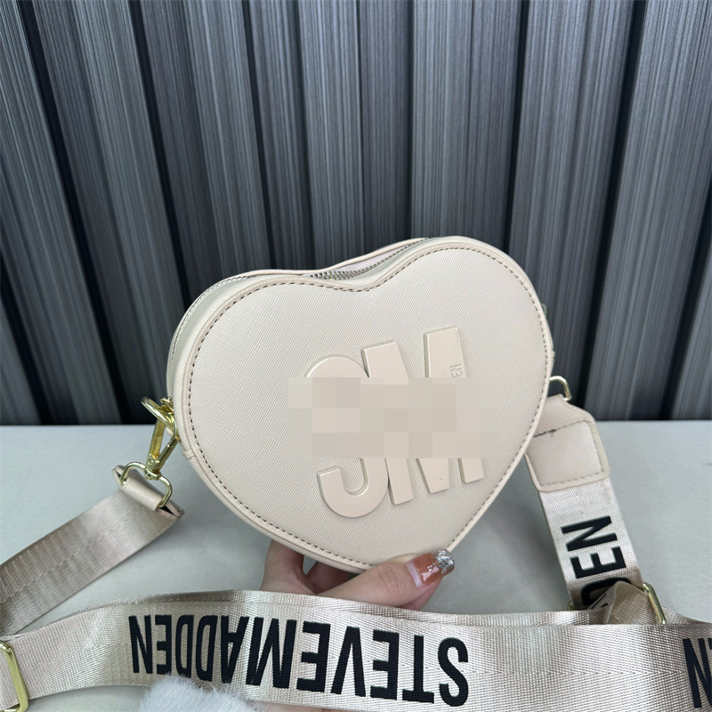 Bolso de hombro transfronterizo para mujer, sentido de alta gama, todo fósforo, letras al por mayor, bolso de mensajero simple, temperamento casual, bolso en forma de corazón