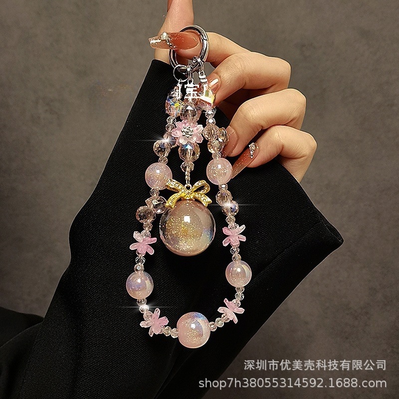 High-end crystal mobile phone charm with fashionable flower beaded bow pendant, hand chain, mobile phone lanyard, anti-loss chain