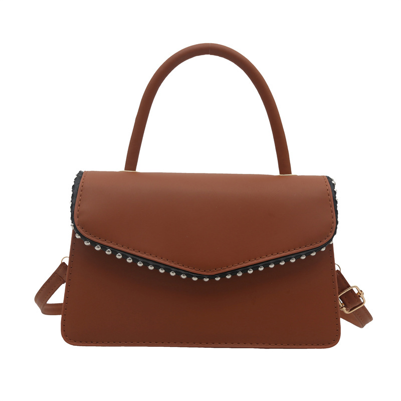 Bolso de hombro de aire extranjero para mujeres 2025 primavera nueva moda coreana portátil de color sólido simple bolso de tendencia