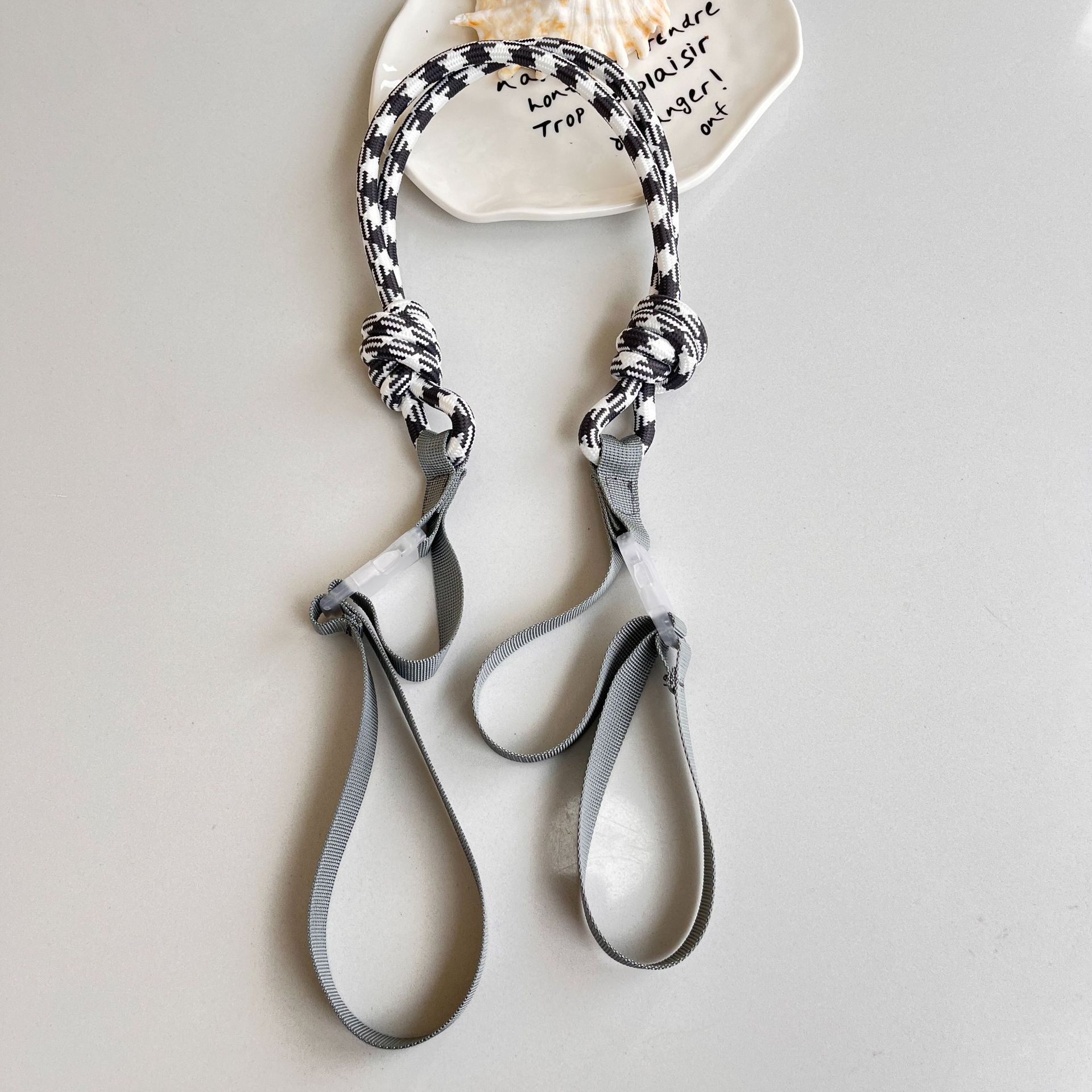 Gray -white colored shoulder strap
