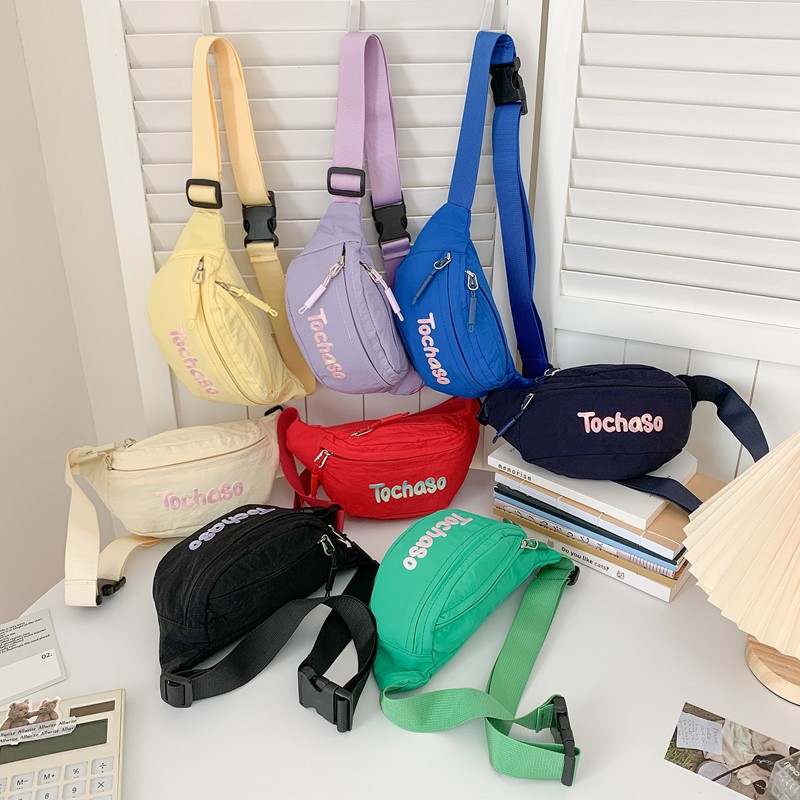 Bolsas deportivas casuales coreanas para niños y niñas, letras populares para bebés, bolsas de cambio de viaje 2026 nuevas bolsas de cintura para niños