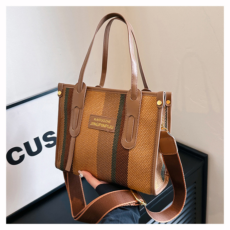 Bolso Tote portátil a rayas de color de contraste de lona para mujer 2024 nueva textura de moda transfronteriza bolso de mensajero de un solo hombro