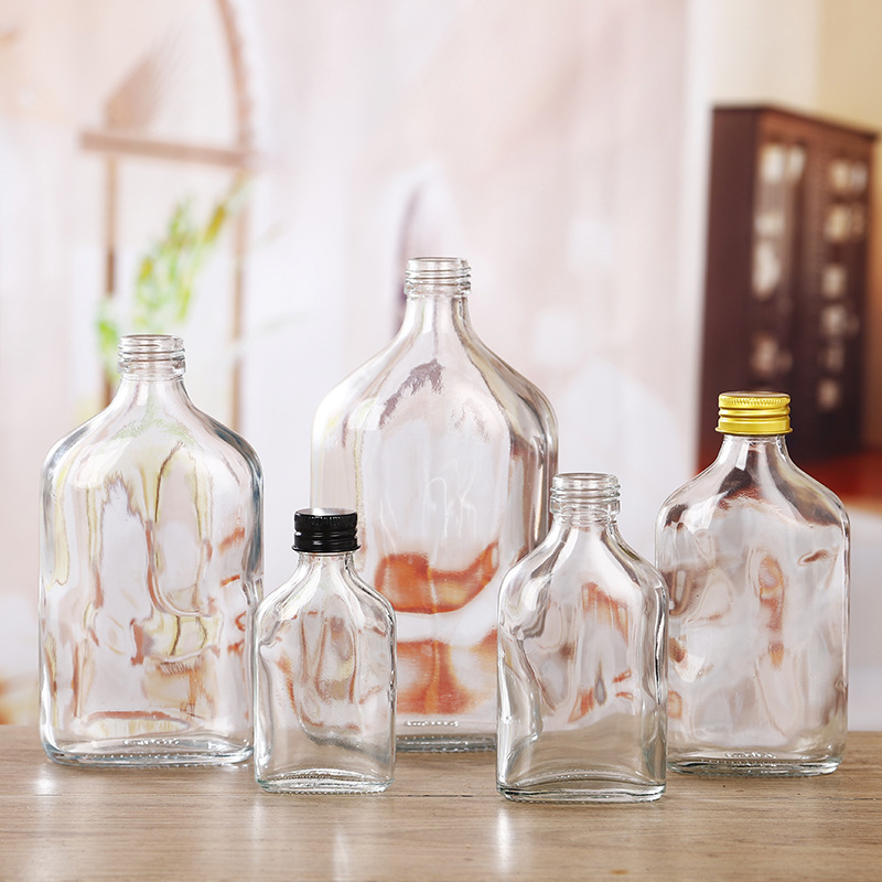 厂家批发斜肩水滴造型饮料瓶果酒瓶扁瓶冰咖冷饮奶茶透明玻璃瓶