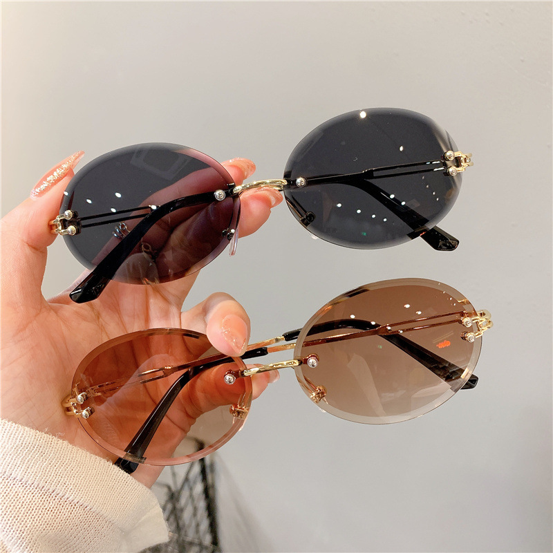 New Sunglasses Women's Oval Gradient Sunglasses Frameless Cutting Edge Trendy Glasses_voghion.com