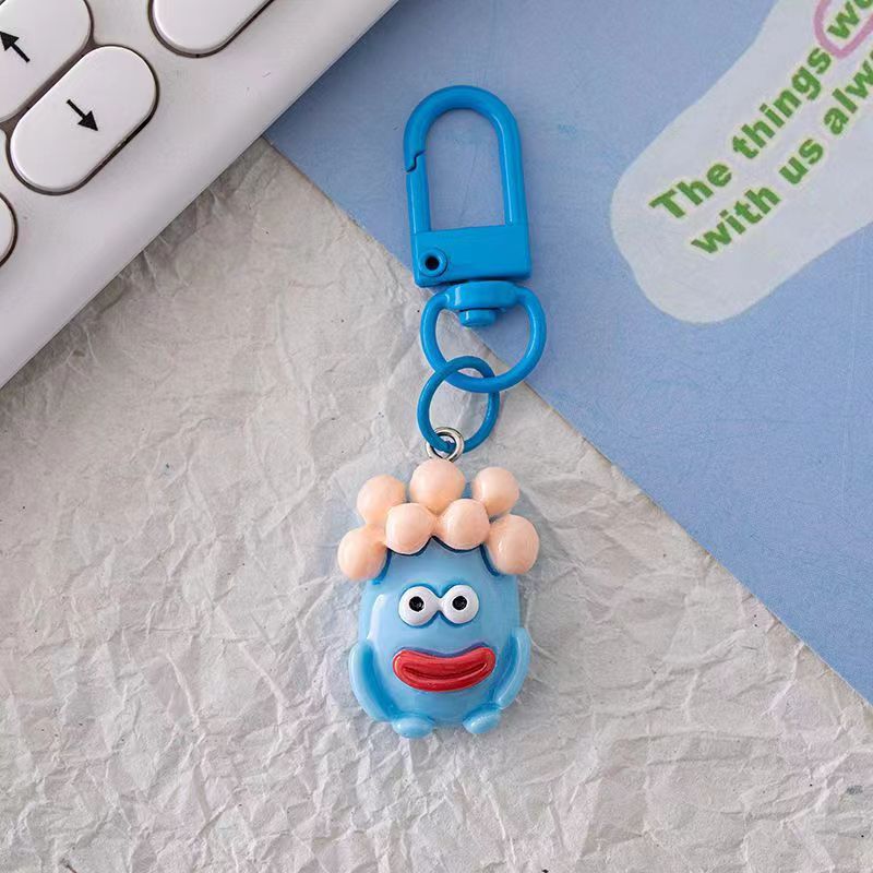 Bonita boca grande extraña llavero salchicha colgante estudiante pequeño libro rojo con accesorios colgante de color para amigos regalos