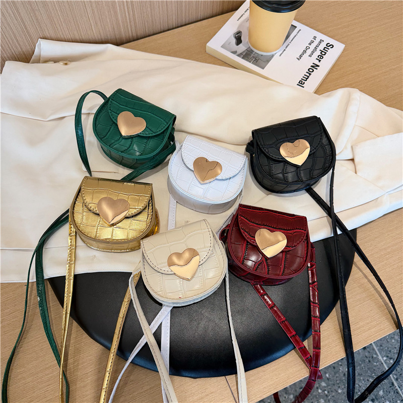 Coreano estilo extranjero piedra patrón bolso de hombro para hombres y mujeres, mini amor para padres e hijos mochila, bolso de moda para niños.