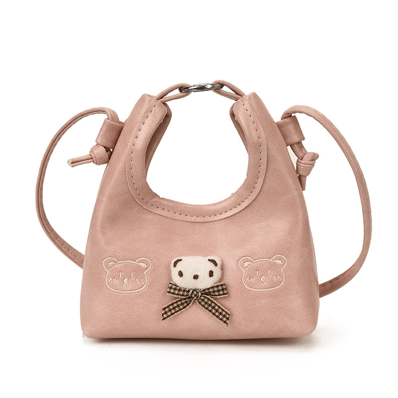2026 nuevo bolso infantil de dibujos animados osos mini bolso de mano bebé adorable bolso de accesorios de niña pequeña