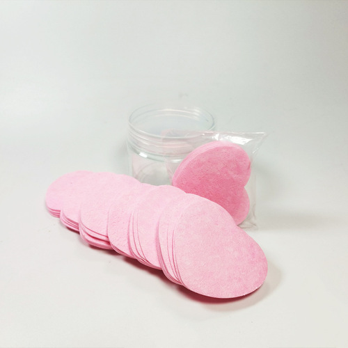 Compressed heart-shaped wood pulp cotton facial puff for washing face, cleansing, makeup removal, and powder application; can be soaked in water to transform into a large sponge facial puff.