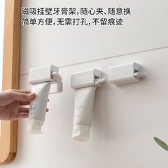 クリップタイプの歯磨き粉器の壁掛け洗顔料押出機の多機能家庭用ラックのハンガーの代理