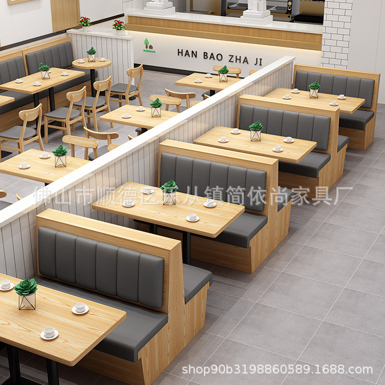 テーマレストランのテーブルと椅子の飲食ハンバーガー鍋焼肉ミルクティー店の喫茶店は壁のカードのソファーの組み合わせに寄りかかっています。|undefined