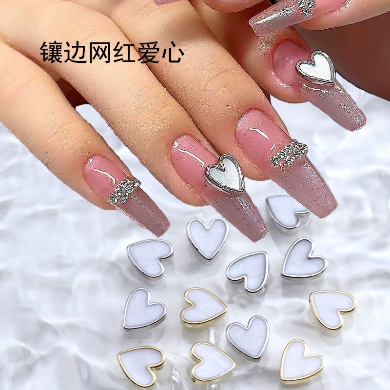 Popular Nail Art Accessories: Mother-Of-Pearl Nail Decorations, Heart-Shaped Metal Nail Charms, Diamond Shell Stone Net Decorations, Rhinestone Embellishments Popular Nail Art Accessories: Mother-Of-Pearl Nail Decorations, Heart-Shaped Metal Nail Charms, Diamond Shell Stone Net Decorations, Rhinestone Embellishments
