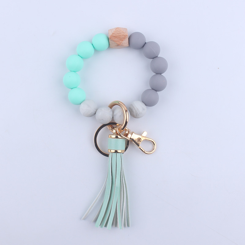 Nuevo cuero de LA PU corto Borla Llavero DIY de silicona de impresión de leopardo de color sólido con cuentas muñeca llavero colgante