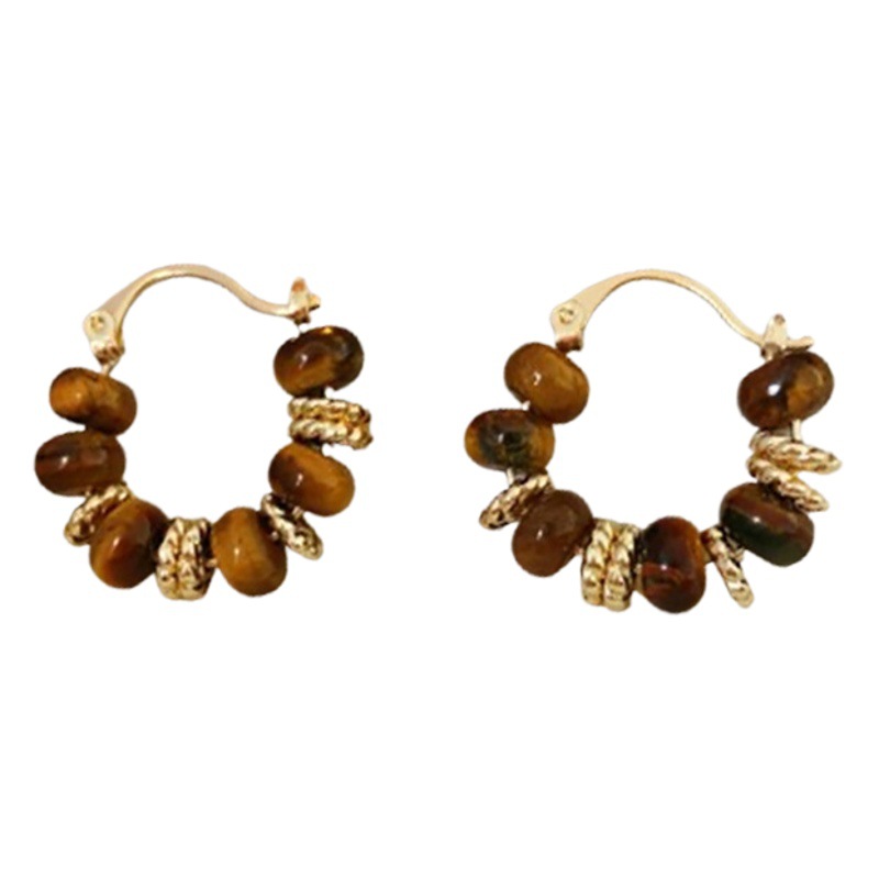 Oro Real electrochapado redondo Ojo de Tigre Piedra Oído hebilla de otoño e invierno pendientes de moda retro elegante alto sentido pendientes de fábrica al por mayor