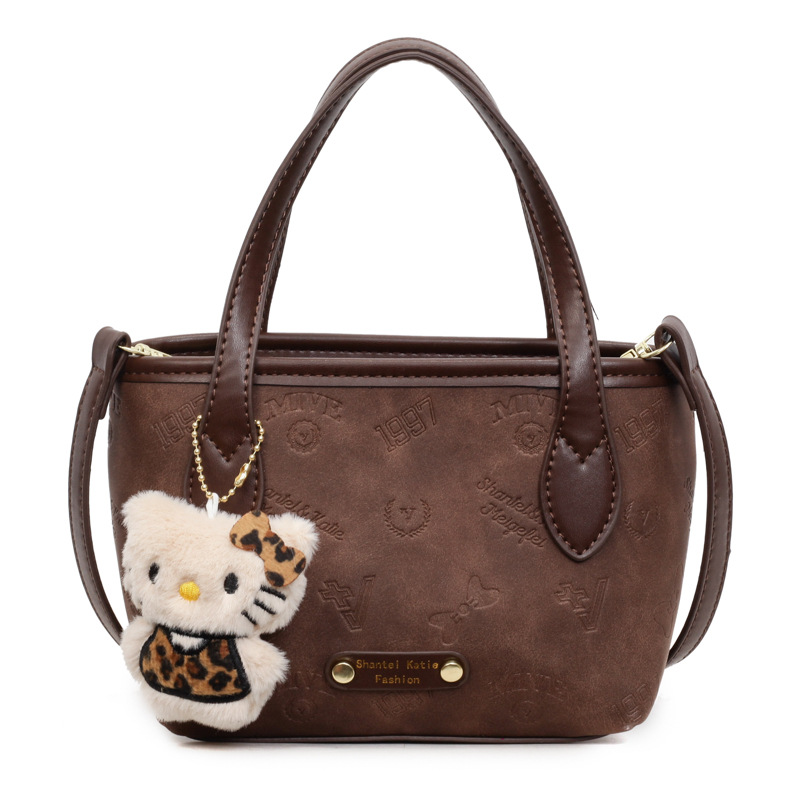 Corea del Sur super caliente retro bolso de mano de estilo extranjero para mujeres 2025 nueva moda simple hombro mochila bolso de cubo de moda