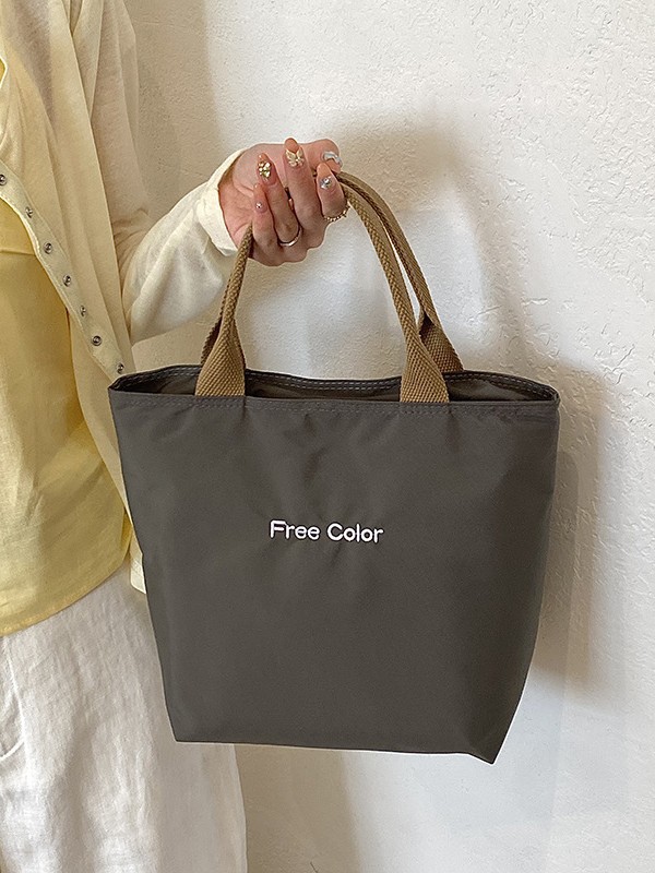 Nicho de diseño nuevo bolso de nylon de color sólido portátil de gran capacidad simple ocio versátil bolso de compras de viaje diario