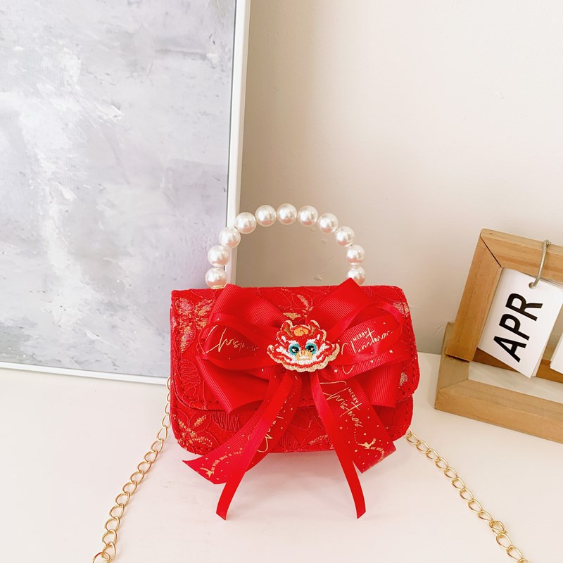 Pequeño viento rojo perfumado bolsos de Año Nuevo para niños y niñas lindos bolsos de perlas de arco 2025 nuevos bolsos de cadenas para niños