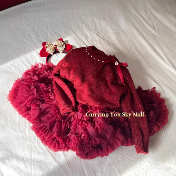 Demi-season children's red knitted sweater with bow with a round…