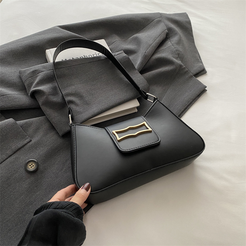 Bolso de brazo ligero de lujo para mujeres 2024 verano nuevo nicho de moda diseño de alta sensación ondulada mochila de hombro