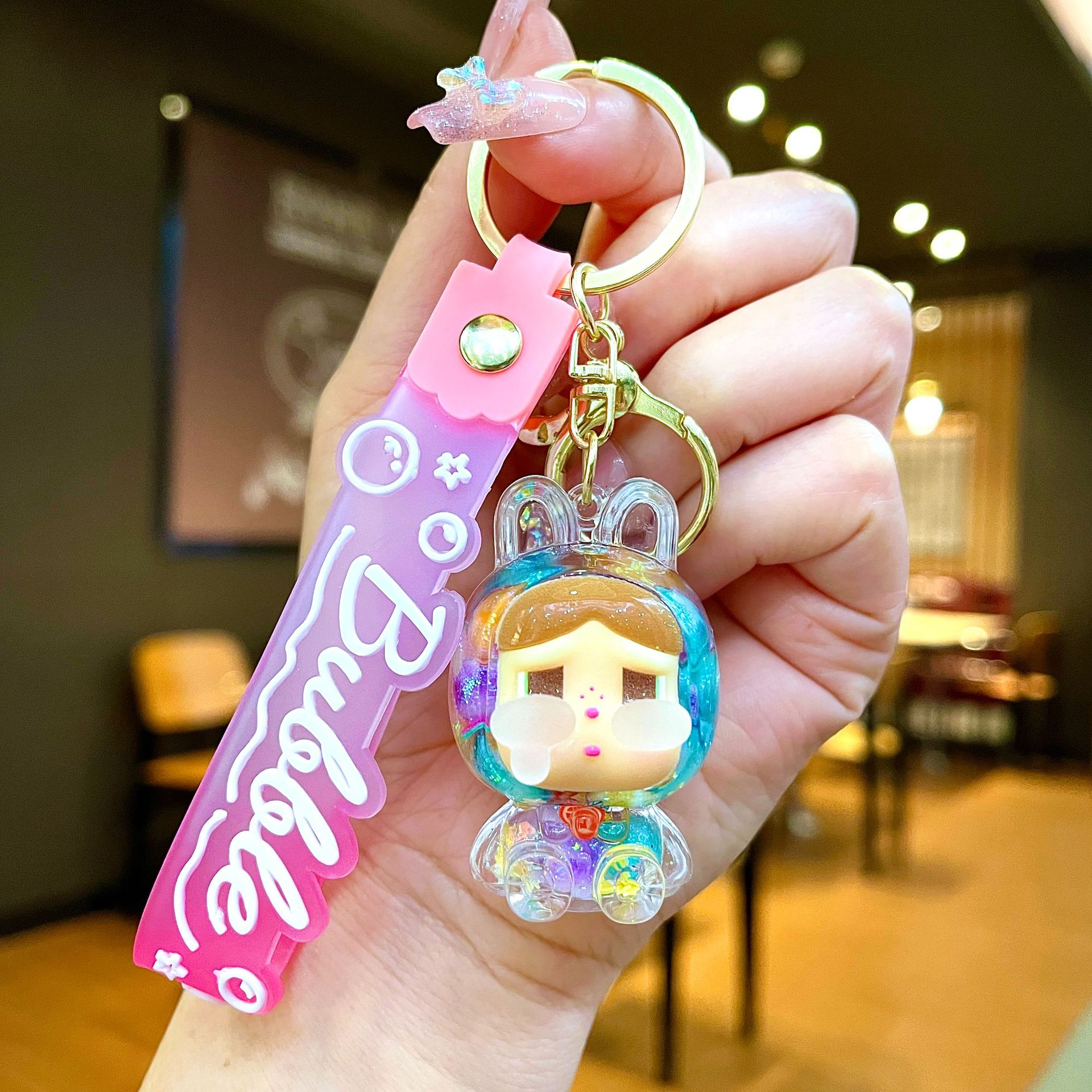 Llavero red acrílico con arena flotante