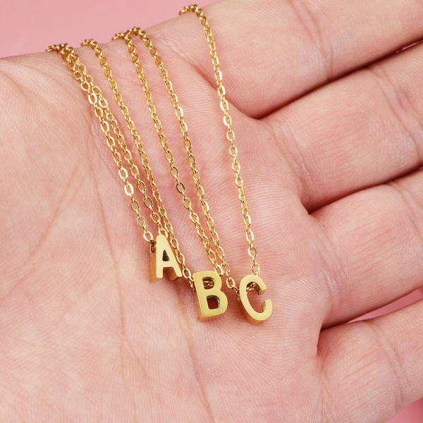 golden necklace with letters