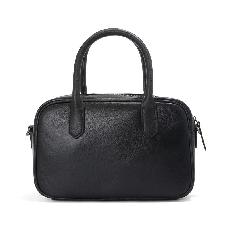 高級感のある植物タンニンなめしの第一層牛革ボストンボウリングバッグ、レディースレトロブラック通勤用ハンドバッグ、ショルダーバッグ、クロスボディバッグ