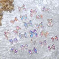ネイルアクセサリーの蝶結びの卸売りの極光の幻彩の立体の小さい蝶の熊のアンドロメダの金の百合の爪の小さい装飾
