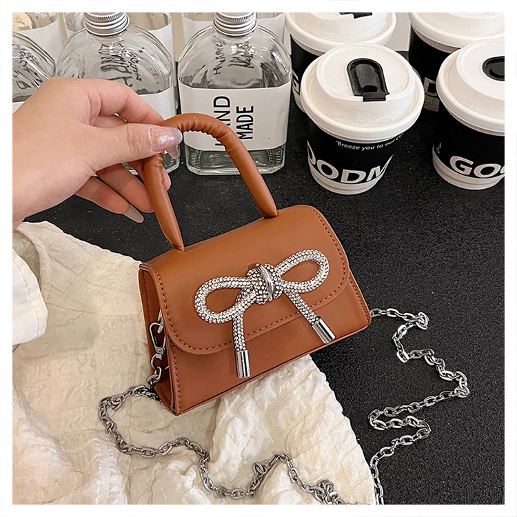 Ins niche French textured bag female 2024 new bow small square bag stylish shoulder messenger bag_voghion.com