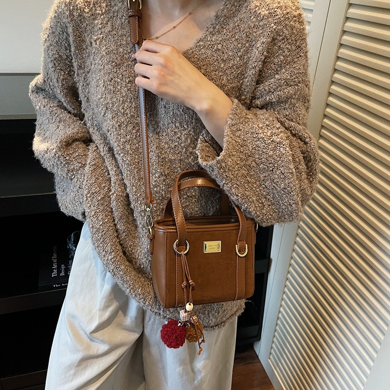 Bolso coreano retro de alta calidad bolso de cubo de agua mujer otoño / invierno 2025 nuevo simple bolso de hombro mochila casual