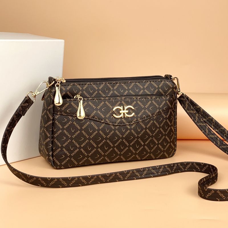 Guangzhou Hengli 2024 nuevo bolso de mensajero transfronterizo bolso casual de mediana edad bolso de teléfono móvil para mujer bolso de venta caliente bolso de hombro