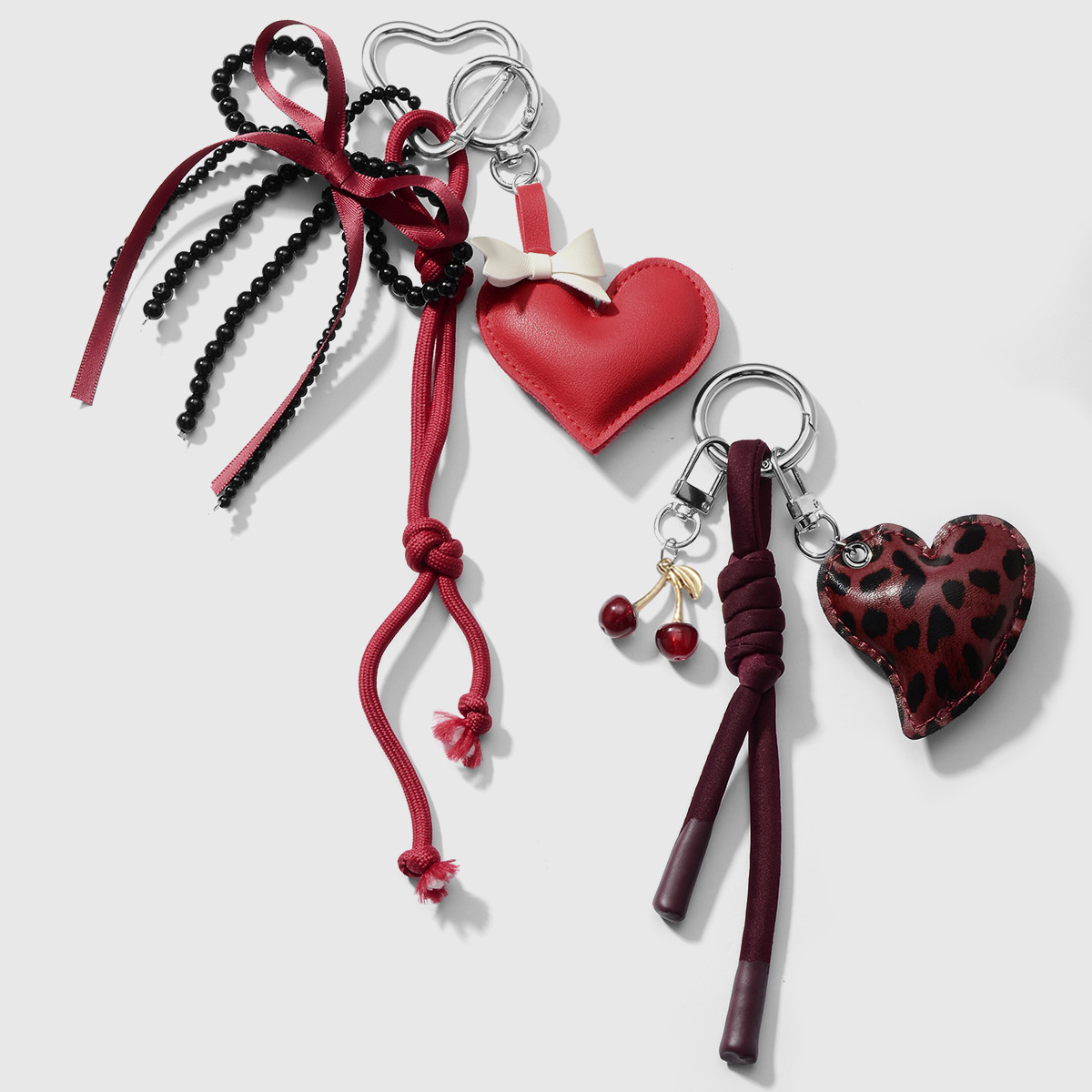 Primavera nuevo estilo ins dulce y cool moda personalidad leopardo amor cuentas hechas a mano arco llavero de cereza