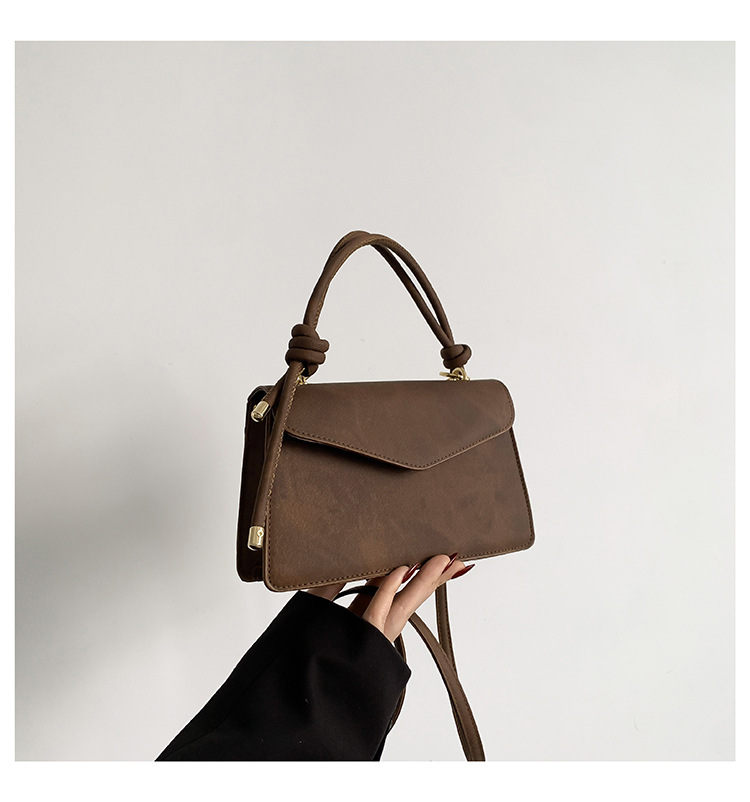 Neto rojo Joker tendencia de color sólido bolso simple bolso de las mujeres 2024 Invierno nuevo bolso cuadrado pequeño oblicuo Cruz Portátil Bolsa de costura del coche