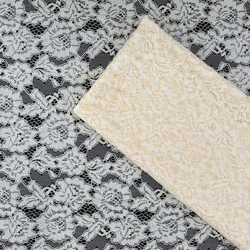 Tejido de encaje de color crema, tela de encaje no elástica, fabricación de falda, fábrica de vestidos, inventario al por mayor.